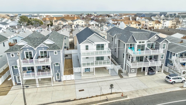 birds eye view of property with a residential view