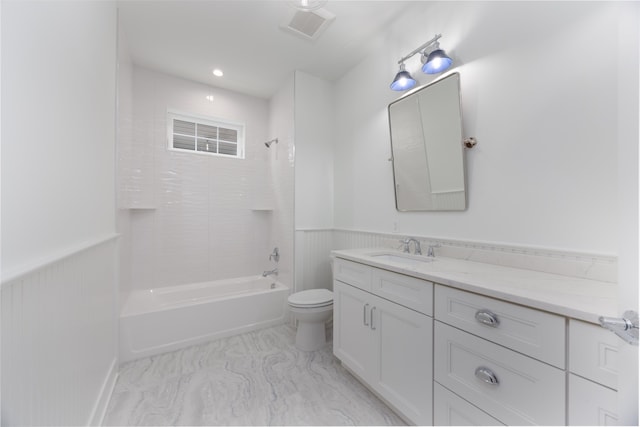 bathroom featuring visible vents, toilet, a wainscoted wall, tub / shower combination, and vanity