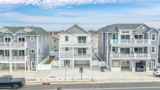 view of front facade with driveway, an attached garage, and a residential view