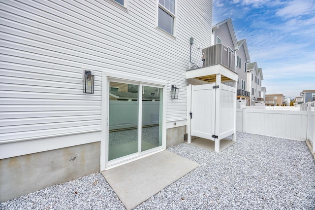 exterior space with a patio, fence, and a residential view