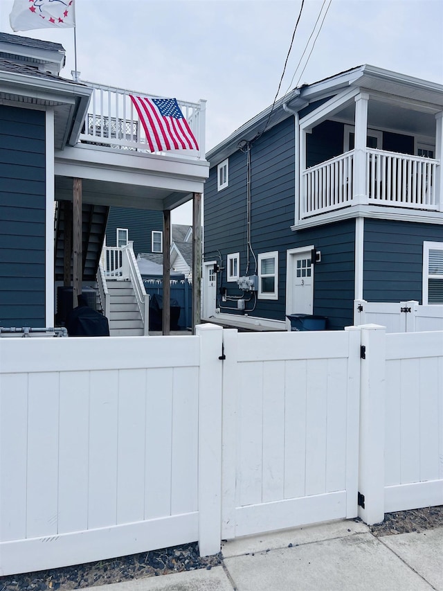 view of home's exterior with a balcony