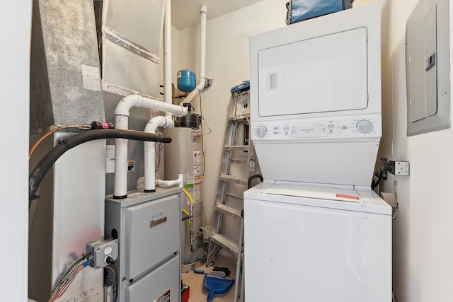 laundry area with water heater, electric panel, and stacked washer and dryer