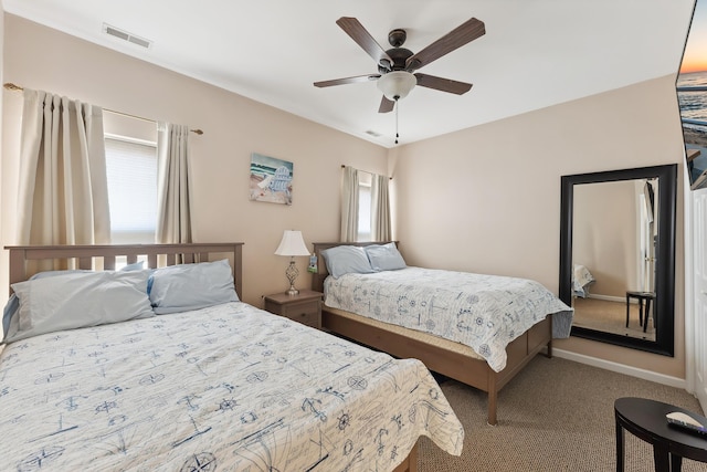 bedroom featuring ceiling fan and light colored carpet