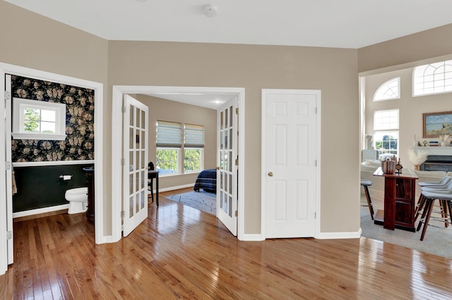 entrance foyer featuring wood-type flooring and french doors