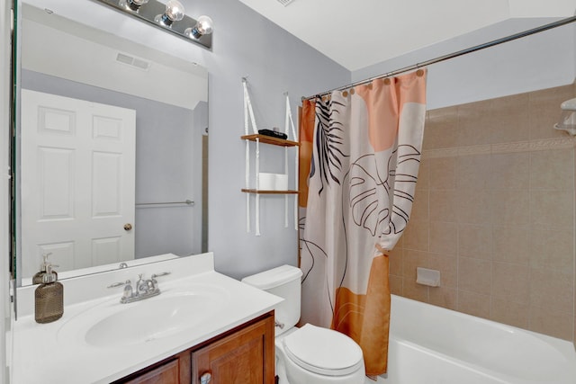 full bathroom featuring vanity, shower / bath combination with curtain, and toilet