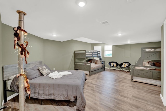 bedroom with hardwood / wood-style floors