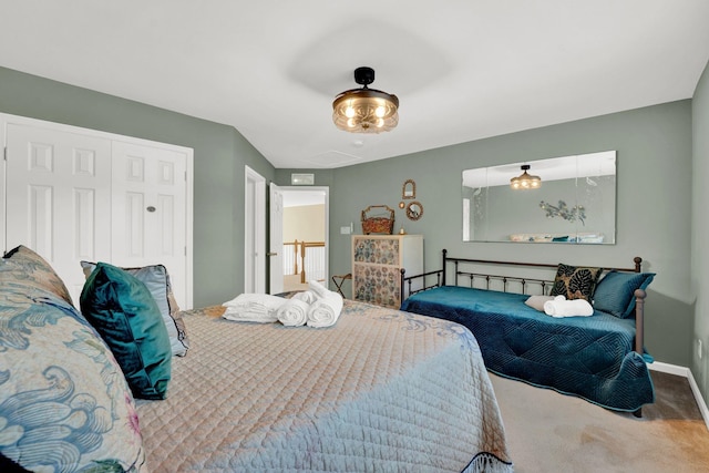 bedroom with carpet flooring and a closet