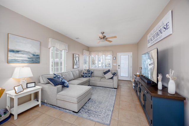 living room with light tile patterned floors, ceiling fan, and visible vents