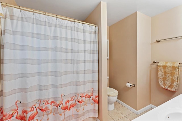 bathroom with tile patterned floors, toilet, curtained shower, and vanity