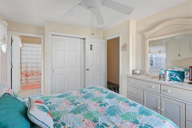 tiled bedroom featuring ensuite bath, a closet, and ceiling fan