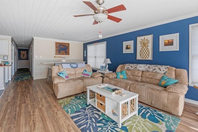 living room featuring wood ceiling, crown molding, ceiling fan, and hardwood / wood-style flooring