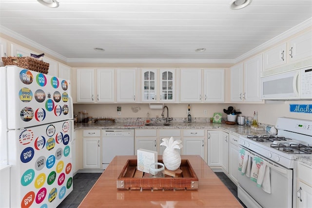 kitchen featuring sink, white cabinets, ornamental molding, light stone counters, and white appliances