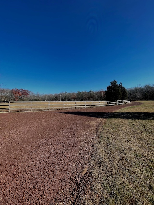 view of yard with a rural view