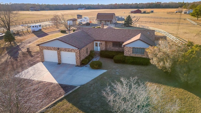 birds eye view of property featuring a rural view