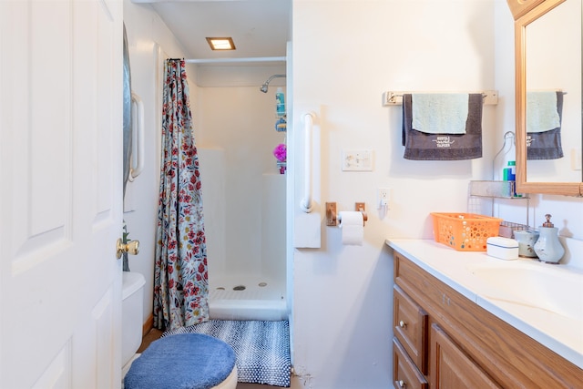 full bathroom featuring a shower stall and vanity