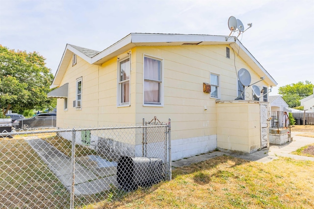 view of side of property with fence