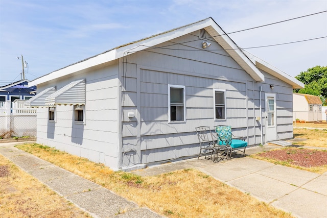 view of side of property with fence