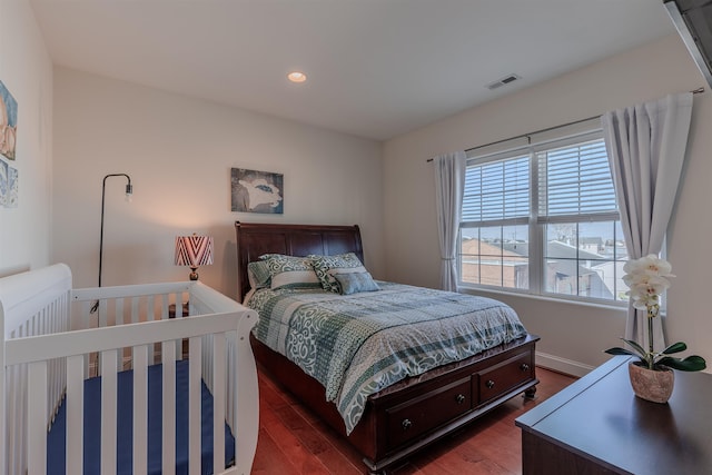 bedroom featuring dark wood-style floors, recessed lighting, and visible vents