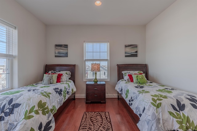 bedroom with recessed lighting, dark wood finished floors, and baseboards