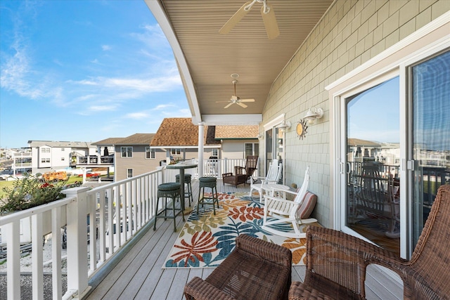 balcony featuring ceiling fan