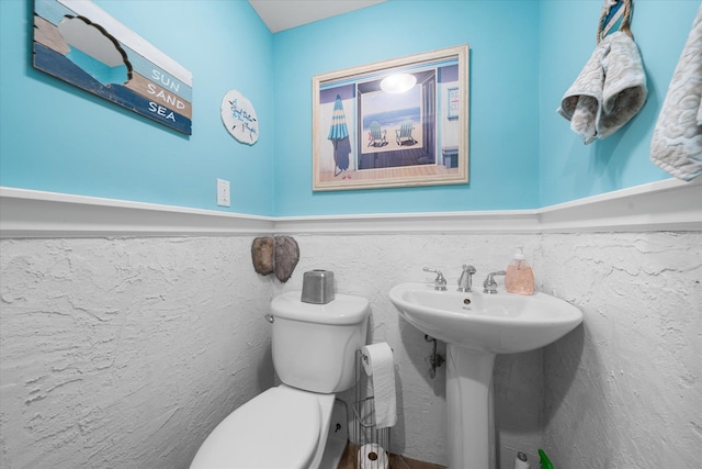 bathroom with toilet and sink