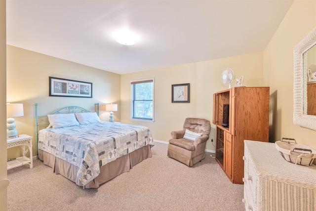 carpeted bedroom featuring baseboards
