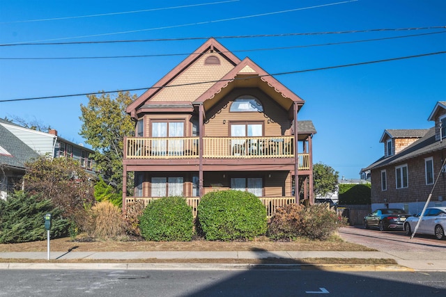 view of front of home with a balcony