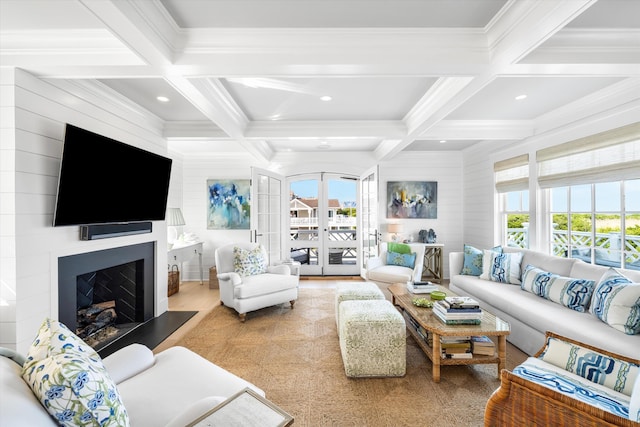 74 38th St, Avalon, NJ 08202 - living room featuring coffered ceiling, beamed ceiling, crown molding, a fireplace with raised hearth, and wood finished floors