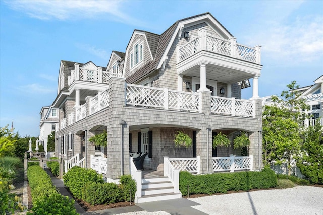 74 38th St, Avalon, NJ 08202 - shingle-style home featuring a balcony and a porch