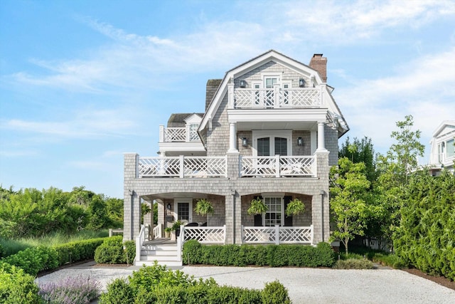 74 38th St, Avalon, NJ 08202 - shingle-style home with a balcony, covered porch, a chimney, and a gambrel roof