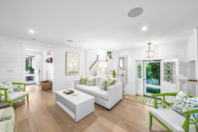 74 38th St, Avalon, NJ 08202 - living room featuring wood walls, light wood finished floors, and recessed lighting