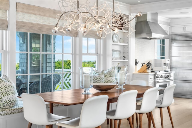 74 38th St, Avalon, NJ 08202 - dining room with a chandelier, light wood finished floors, and crown molding