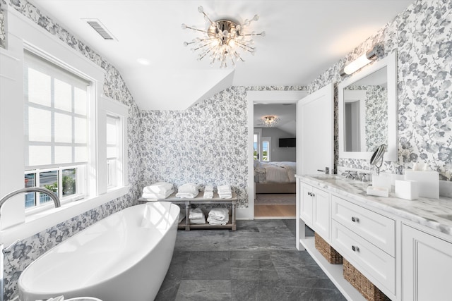 74 38th St, Avalon, NJ 08202 - ensuite bathroom with a soaking tub, vanity, wallpapered walls, and lofted ceiling