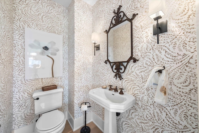 74 38th St, Avalon, NJ 08202 - bathroom with wallpapered walls and wood finished floors