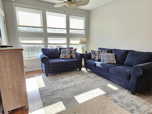 living room featuring hardwood / wood-style flooring and ceiling fan