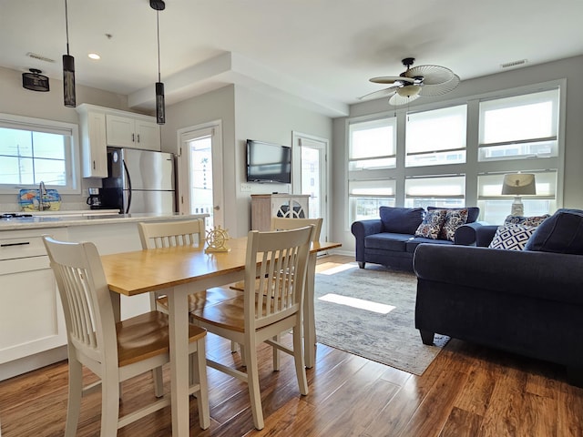 dining room featuring ceiling fan and wood-type flooring