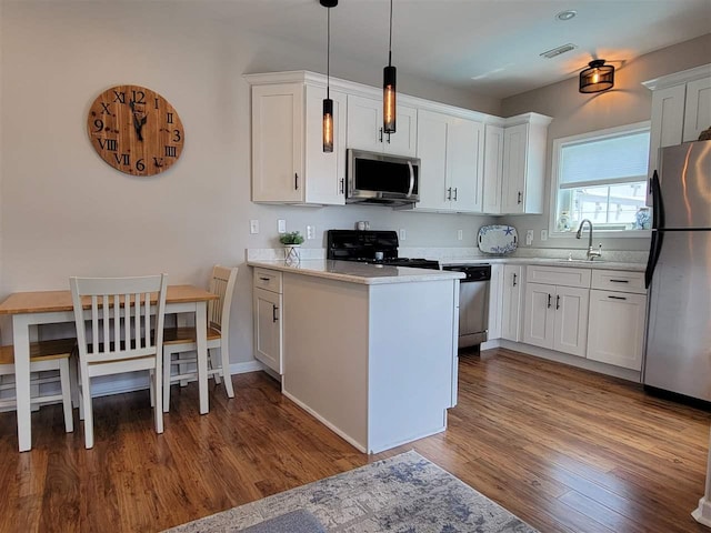 kitchen featuring white cabinets and appliances with stainless steel finishes