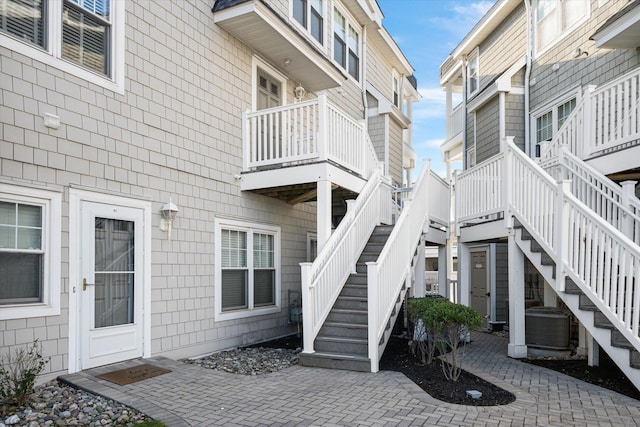 property entrance with a patio and cooling unit