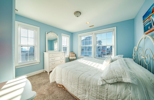 bedroom featuring light carpet