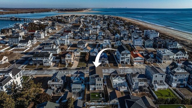 aerial view with a view of the beach and a water view