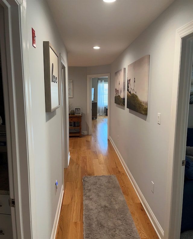 hallway with light wood-type flooring