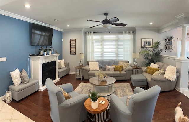 tiled living room with ornate columns, ornamental molding, and ceiling fan