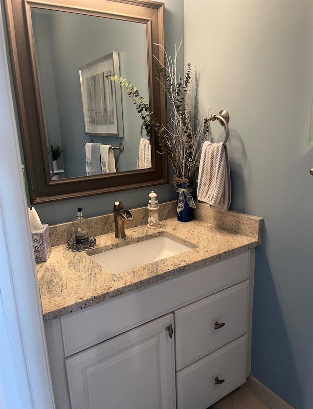 bathroom with vanity and tile patterned floors