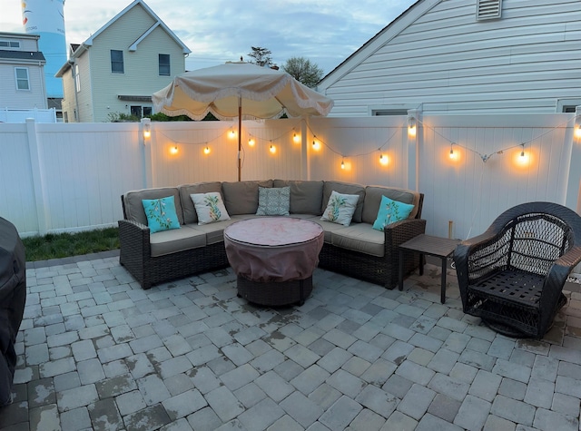 view of patio with outdoor lounge area and fence