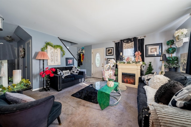 carpeted living room with a fireplace and baseboards