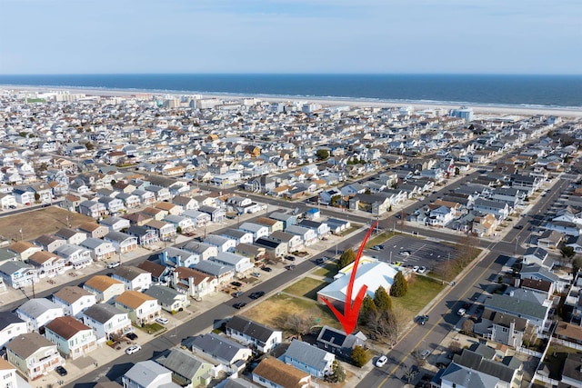 bird's eye view featuring a residential view and a water view