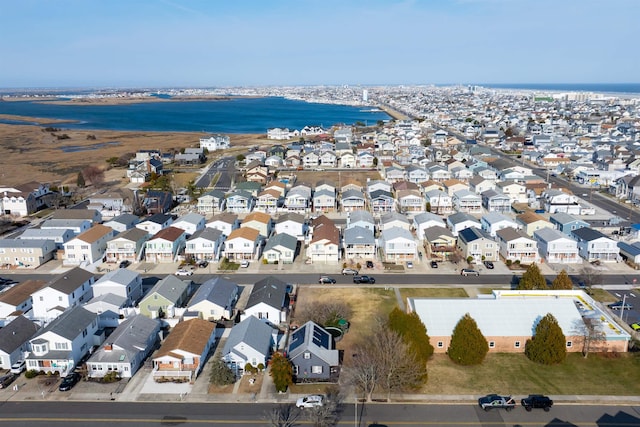 bird's eye view with a water view and a residential view