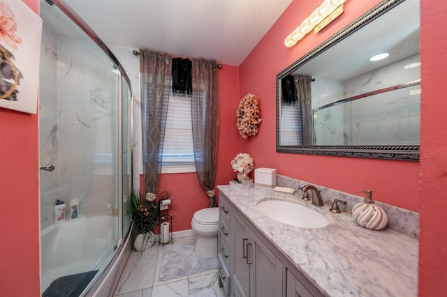 bathroom featuring marble finish floor, a marble finish shower, and vanity