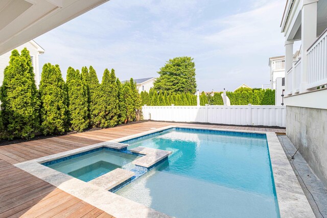 146 22nd St, Avalon, NJ 08202 - view of swimming pool with a pool with connected hot tub, a fenced backyard, and a deck