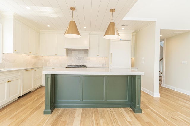 146 22nd St, Avalon, NJ 08202 - kitchen featuring light countertops, light wood-style flooring, white cabinets, decorative backsplash, and recessed lighting